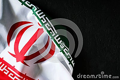 National flag of Iran on a dark background with space for text Stock Photo