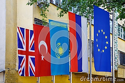 The national flag of the Republic of Kazakhstan is next to the national flags of the United Kingdom, Turkey, Russia Stock Photo