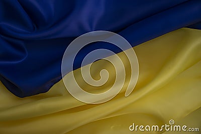 National flag of Ukraine close banner motion silk fabric background Stock Photo