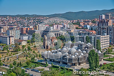 National library of Kosovo and unfinished serbian orthodox church of Christ the Saviour in Prishtina, Kosovo Stock Photo