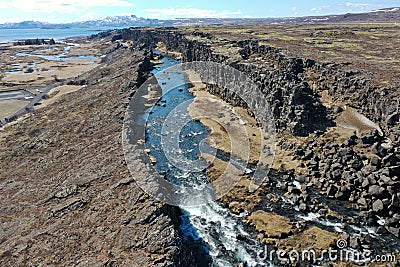 The National Park Thingvellir is very special for the reason that the gorge there is tearing apart the plates. Stock Photo