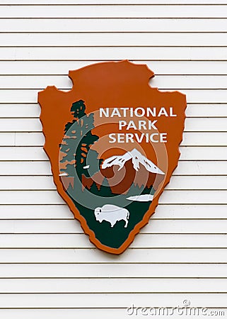 National parks services sign on white exterior wall Editorial Stock Photo