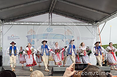 The Nationalities Ball participants: on the stage Polish folk dance ensemble `Gaik`. Editorial Stock Photo