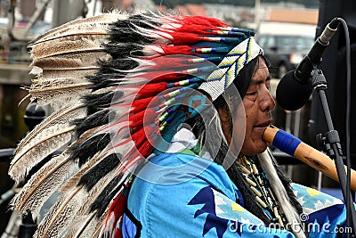 Native american indian plays flute Editorial Stock Photo