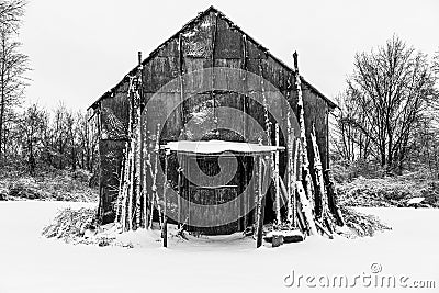 Native American Long House covered in snow in the winter Stock Photo
