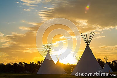 Native American Tepees on the Prairies at Sunset Stock Photo