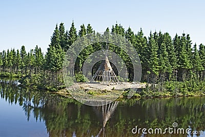Native American tipi on a lakeshore Stock Photo