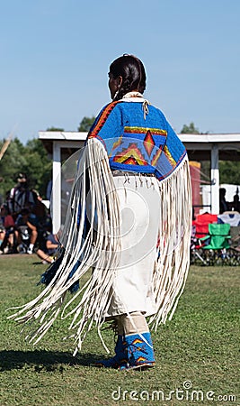 Native American Woman Dancing at Pow Wow with Fringed Dress Editorial Stock Photo