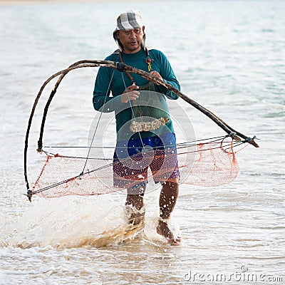 Native local man nets in the sea, Thailand Editorial Stock Photo