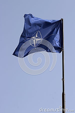  NATO flag on a pole Stock Photo
