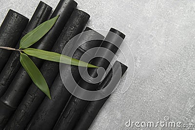 Natural activated bamboo charcoal on concrete background. Realistic pieces charcoal Stock Photo
