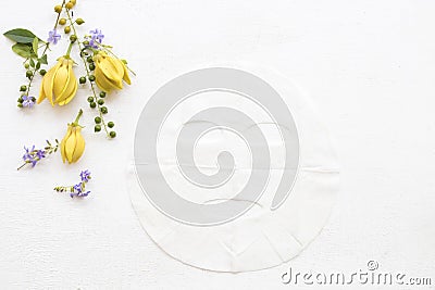 Natural aroma sheet mask from herbal ylang flowers Stock Photo