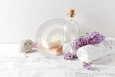 Natural bath salt, soap, cotton towels and lilac flowers symbolic image Stock Photo