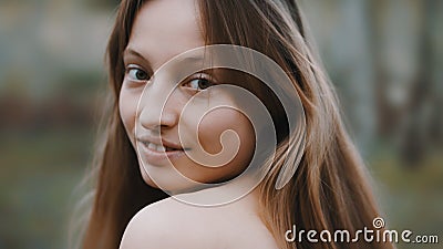 Natural beauty concept. Close up shot of caucasian woman with beautiful green eyes and frekles. Smiling girl. Stock Photo