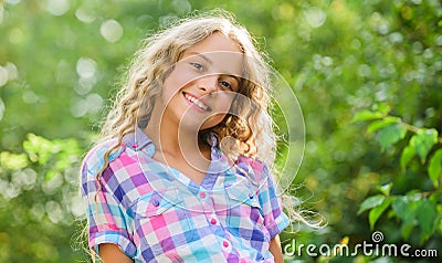 Natural beauty. small girl long culry hair. happy childhood. perfect healthy skin. youth is brilliant. summer holidays Stock Photo