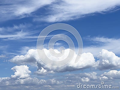 Natural blue sky with thick white cumulus mediocris clouds in the afternoon Stock Photo