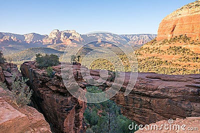 Natural bridge in front of valley view in arizona desert Stock Photo