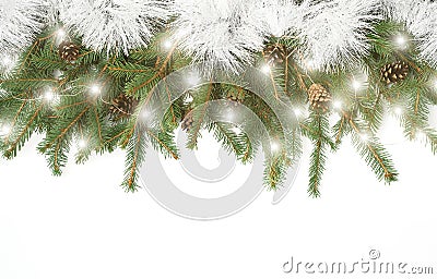 Natural Christmas layout of Christmas tree branches, cones and golden Christmas lights with bokeh on isolated white Stock Photo
