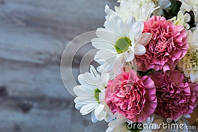 Natural chrysanthemums and carnations from Bulgaria arranged in a simple bouquet Stock Photo