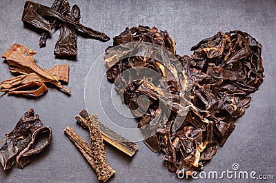 The image of the Heart is laid out from treats for dogs. Stock Photo