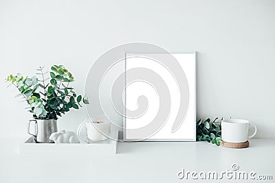 Natural eco home decor with green leaves, poster mock-up and bur Stock Photo