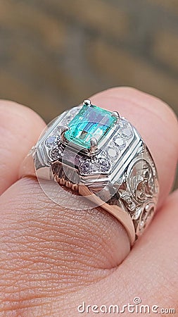 Natural emerald silver ring for men. The hand carved ring with vintage and Malay traditional design. Stock Photo