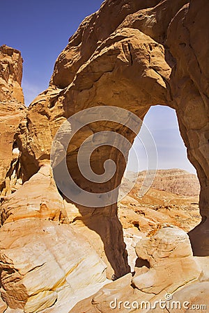 Erosive arch in hills from red sandstone Stock Photo