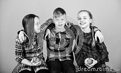 Natural food will do you good. Small group of little children holding natural red apples. Natural joy in healthy eating Stock Photo