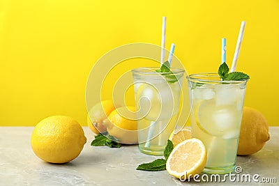 Natural freshly made lemonade on grey marble table. Summer refreshing drink Stock Photo