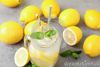 Natural freshly made lemonade and mint on grey table, closeup. Summer refreshing drink Stock Photo