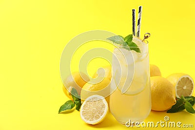 Natural freshly made lemonade on background, space for text. Summer refreshing drink Stock Photo