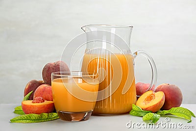 Natural freshly made peach juice on light table Stock Photo