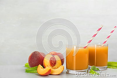 Natural freshly made juice on light table. Space for text Stock Photo