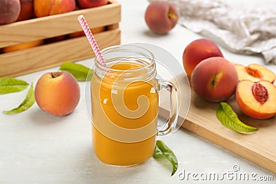 Natural freshly made peach juice on white table Stock Photo