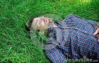 Natural freshness. Nature fills him with freshness and inspiration. Guy relaxed peaceful enjoy freshness of grass. Man Stock Photo