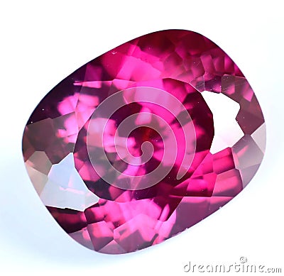 Natural gemstone red rhodolite garnet on gray background Stock Photo