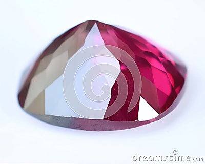 Natural gemstone red rhodolite garnet on gray background Stock Photo