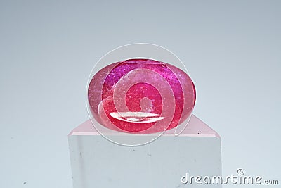 Natural gemstone ruby on a stand white background Stock Photo