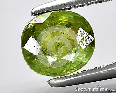 natural green demantoid garnet gem on the background Stock Photo