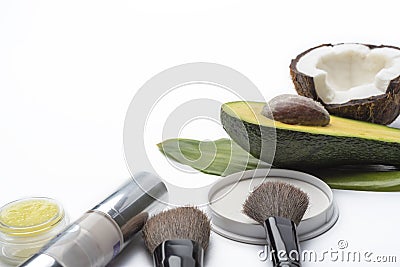 Natural herbal skin care products, top ingredients, coconut, avocado, isolated background makeup brushes for face Stock Photo