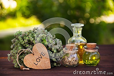 Natural herbs and oils. Aromatic thyme and magic elixir. The love drink. Love potion. Alternative medicine. Stock Photo