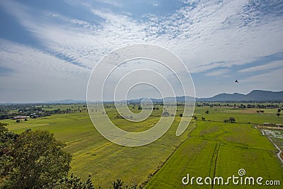 Natural high angle views, rice fields with sky and mountains behind Kanchanaburi, Thailand Stock Photo