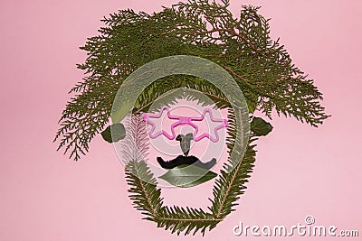 natural hippie art background, head with modern glasses on a pink background Stock Photo