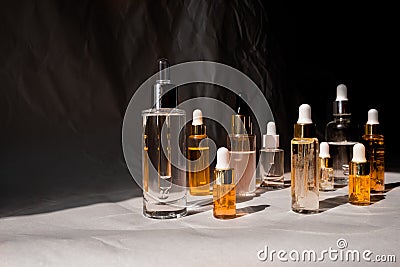 Natural hyaluronic serum on trendy abstrac background. Natural materials and skin care concept. Haed light and Stock Photo