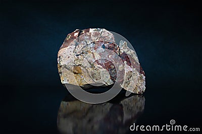 Natural jasper stone on a dark background. Stock Photo