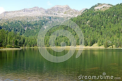 Little mountain lake with panorama on dolomites Madonna di Ca Stock Photo