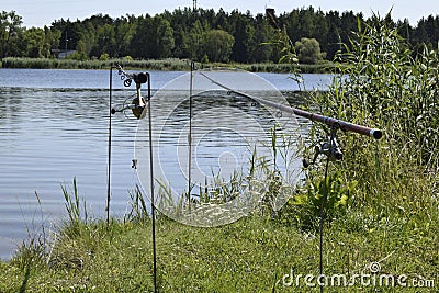 Natural landscape of Belarus, Russia and Baltics. Summer, day, river. Fishing rods are established. Stock Photo