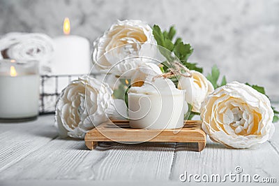 Natural loofah scrubber on podium in bathroom. Zero waste in life. Relaxation spa concept, candles, beauty.. Stock Photo