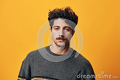 Natural man face portrait sweater background looking fashion happy smile trendy orange lifestyle hispanic student Stock Photo