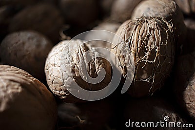 Natural nut. Dark background texture pattern. Abstract walnuts pattern background. Walnuts pattern background. Inshell walnuts. Stock Photo